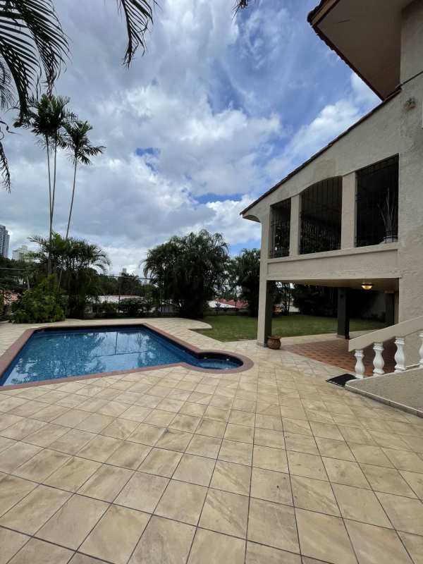 Resort-style pool with jacuzzi surrounded by tropical landscaping in luxury Panama house