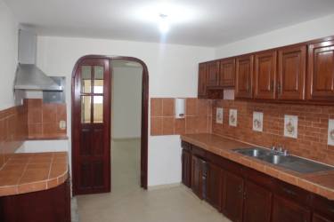 Bedroom with built-in closets and view into ensuite bathroom, Natá Panama house sale