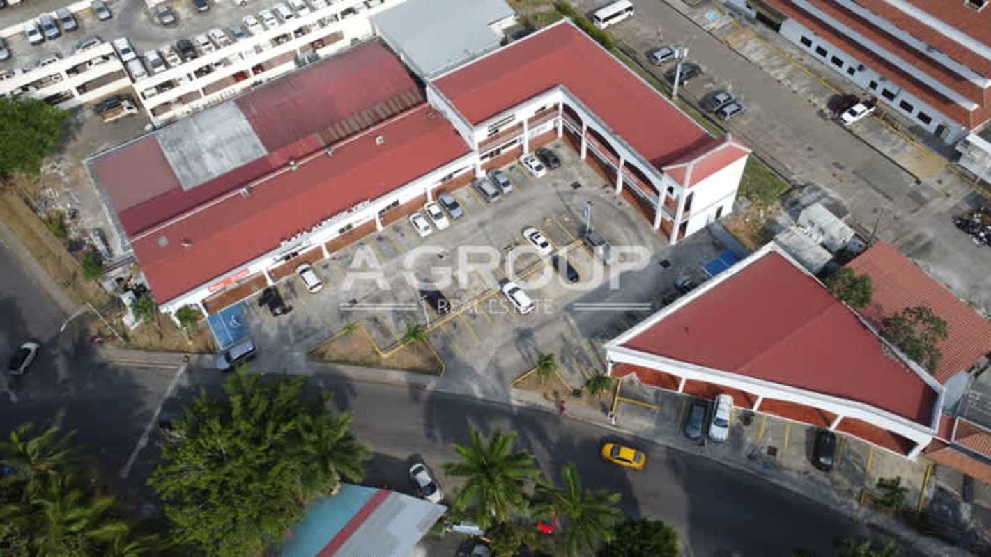 Aerial shot of Albrook View Plaza featuring red roofs, multiple commercial units and large parking