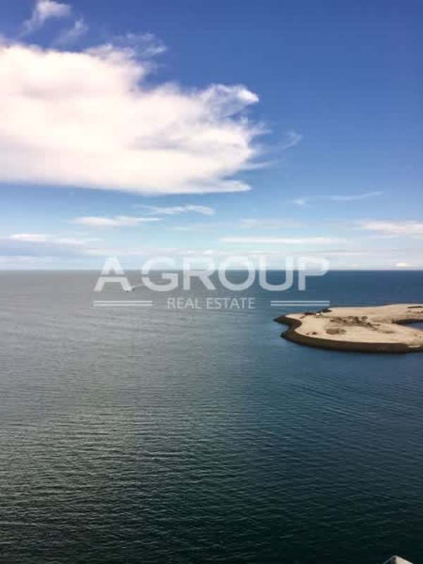 Open dining area with marble floors and floor-to-ceiling windows at The Ocean Club Panama City