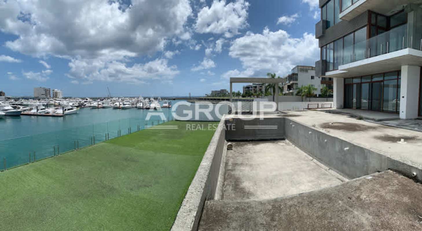 Luxury modern villa with large windows, glass balconies overlooking marina at Ocean Reef Panama