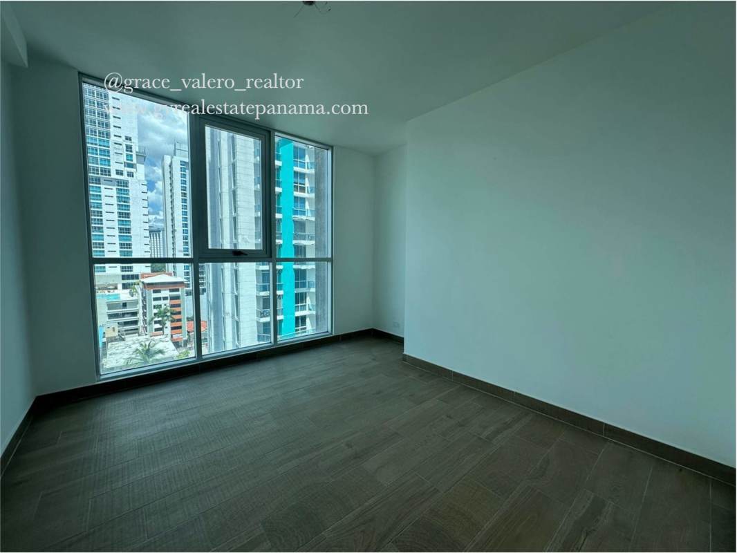 Modern bathroom with glass-enclosed shower, marble accents PH Dynasty Bella Vista Panama City