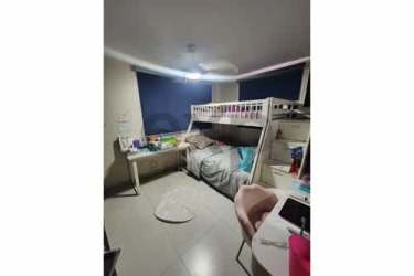 Bedroom with gray bedspread, built-in wood wardrobe, TV stand Woodlands Panama Pacifico