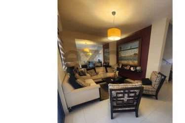 Master bedroom with wardrobe, mounted TV, bright window in Woodlands Panama Pacifico