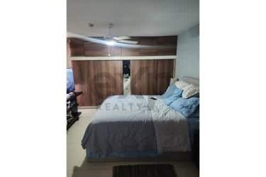 Bedroom with built-in closet, tile flooring in Panama Pacifico duplex