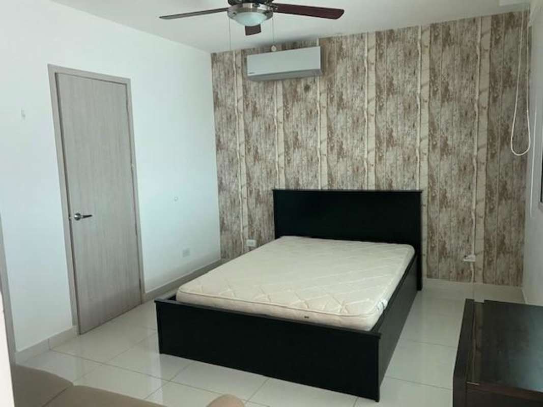 Modern bedroom with city skyline view in loft apartment PH Loft Four 41 San Francisco Panama