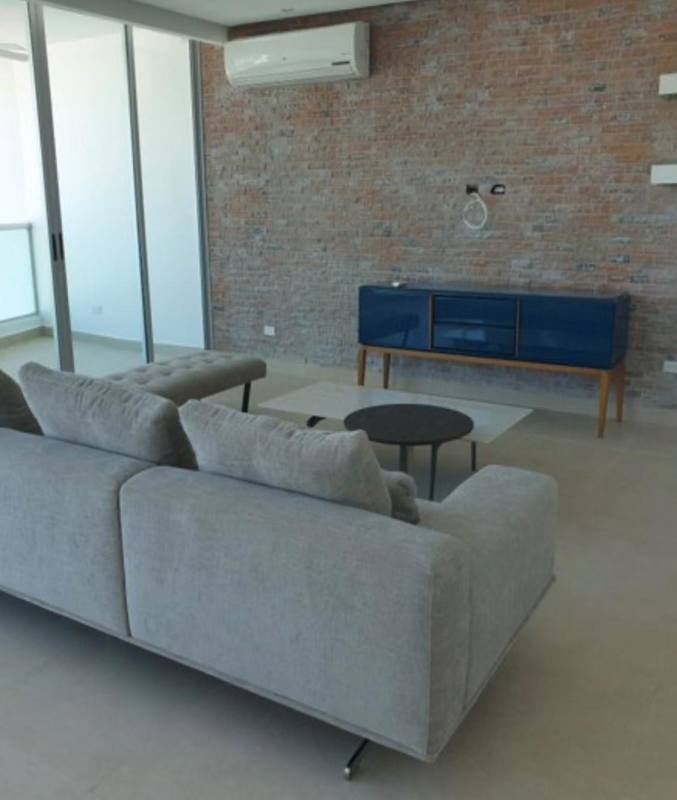 Large balcony with glass railing overlooking Panama City skyline at PH Loft Four 41 San Francisco