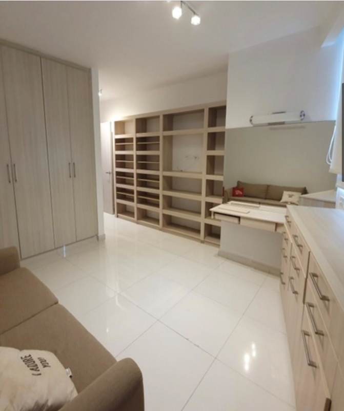 Open kitchen with breakfast bar and modern dining space in loft apartment PH Loft Four 41 Panama City