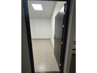 Empty versatile commercial unit with white walls and tiled floor Las Mañanitas Panama