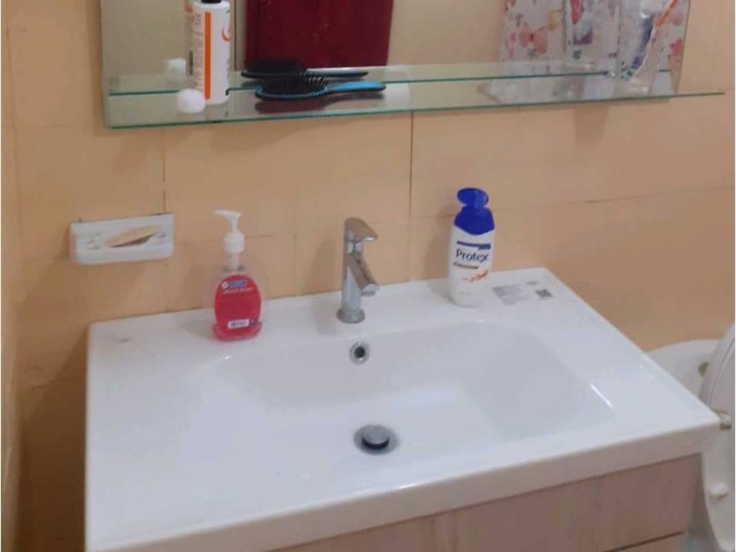 Bedroom with window, built-in closet and tiled floor in furnished PH Devalor apartment El Cangrejo Panama City