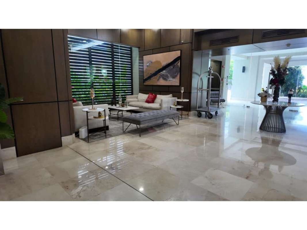 Contemporary kitchen with island and stainless appliances at luxury apartment The Reserve Panama