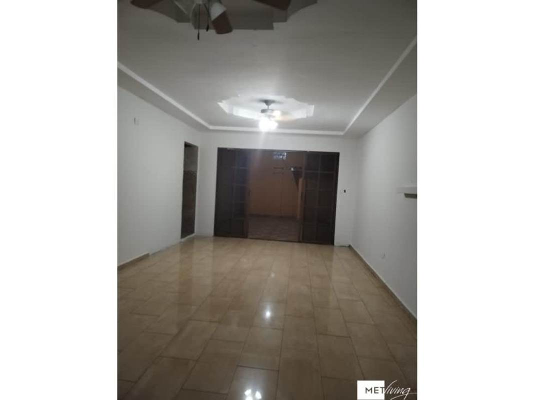 Large open living room with ceiling fans, sliding doors, ceramic tile in house for sale Panama