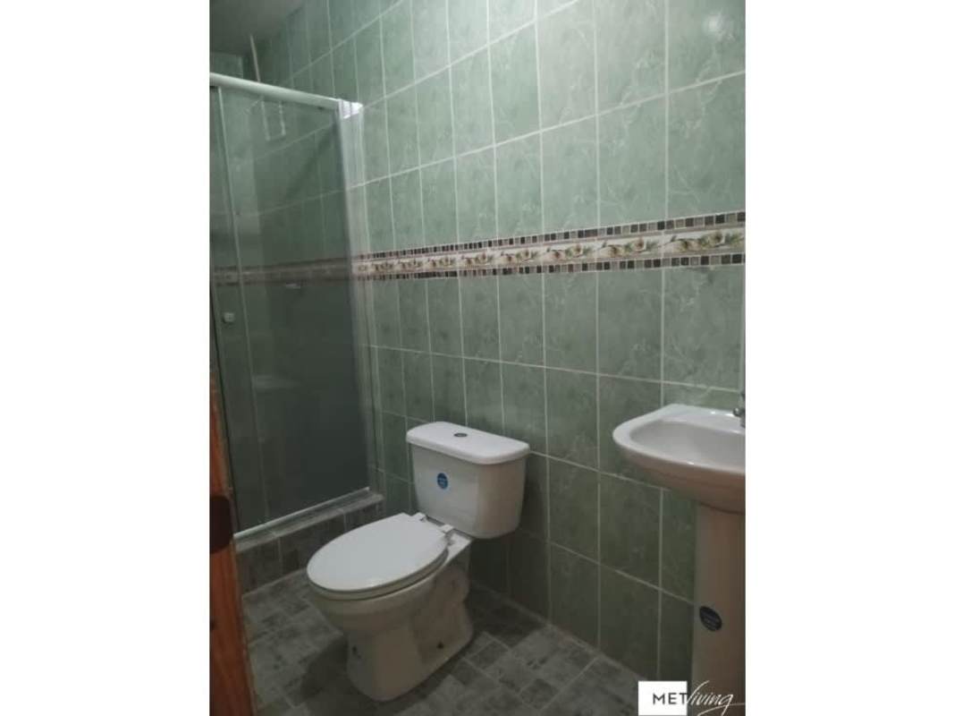Bathroom featuring glass shower, green tiles, ceramic toilet in Villa Lucre Panama