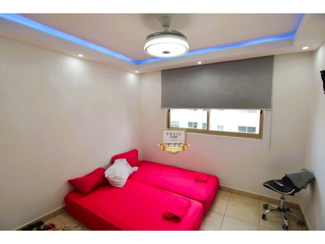 Open plan modern living room with sectional sofa at PH San Francisco Bay Panama