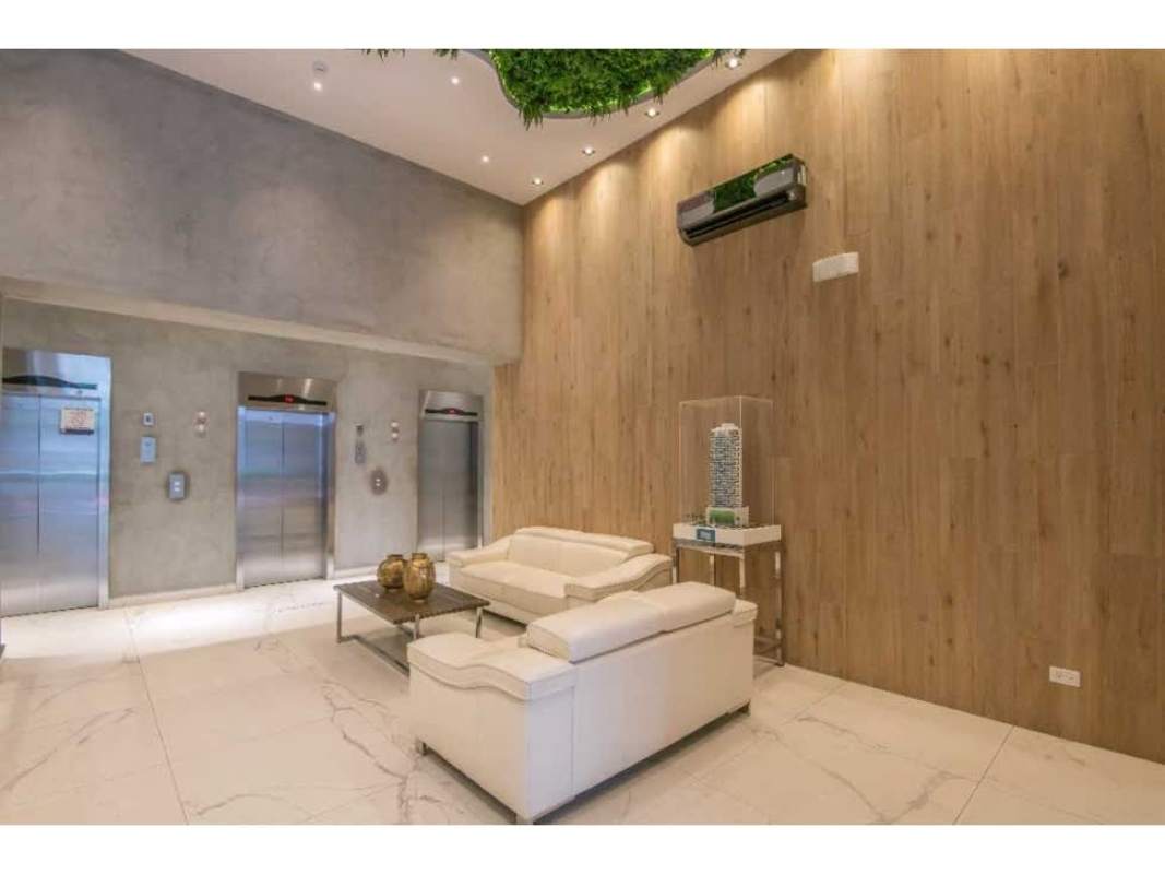 Covered infinity pool lounge area with city vistas at PH GV43 Panama City luxury apartment