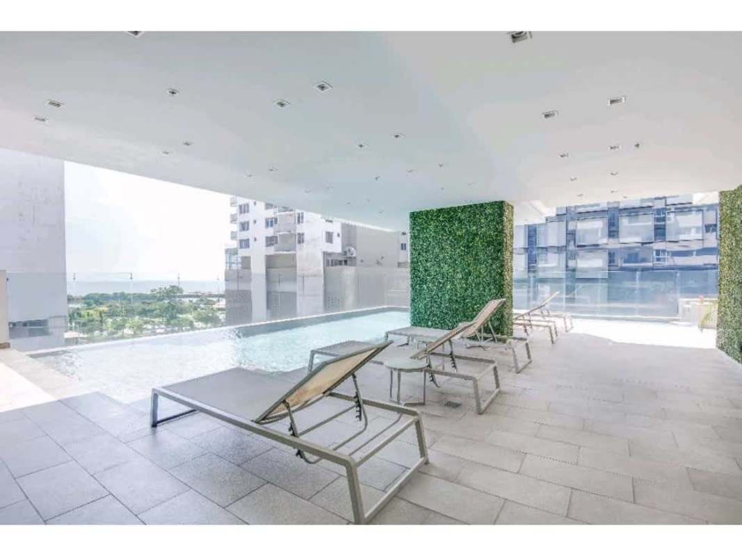 Rooftop infinity swimming pool with lounge chairs and city skyline views at PH GV43 Bella Vista Panama City