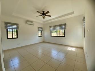 Spacious covered terrace with view of green garden at Hacienda Pacifica country home Panama