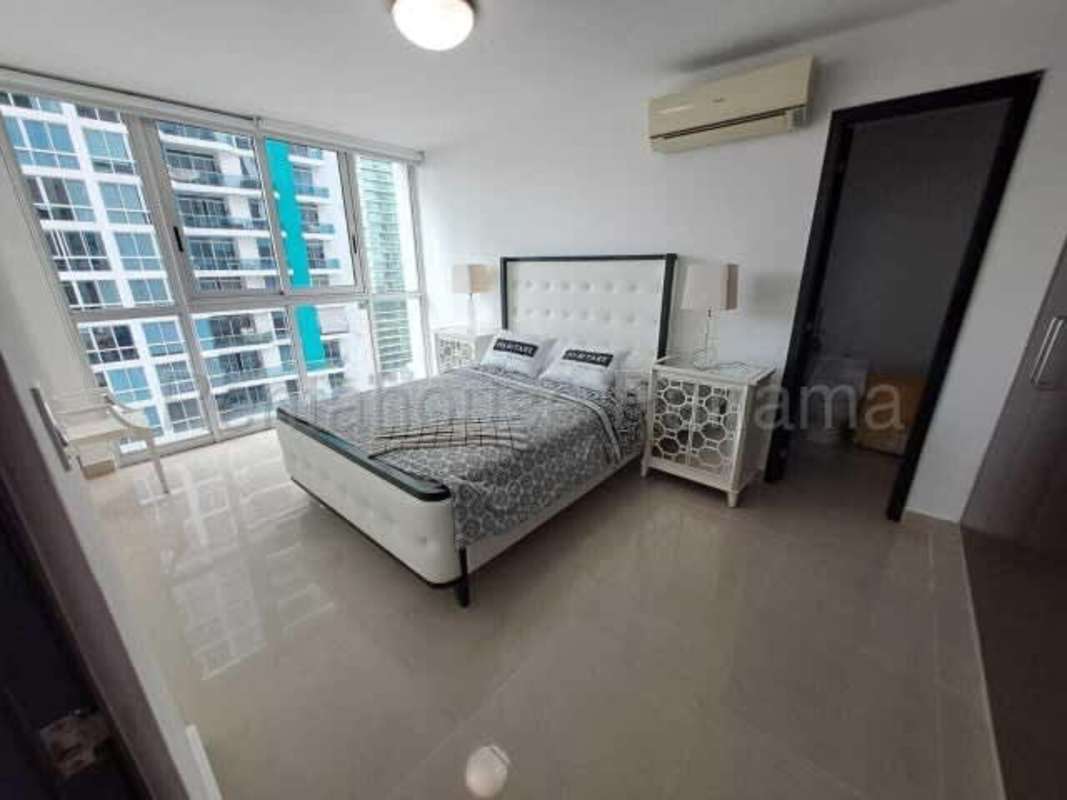 Bright bedroom with built-in closet AC unit large window apartment Bella Vista