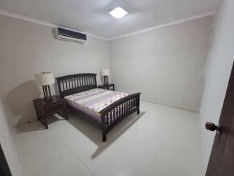 Covered patio with garden view in furnished beach house at Las Lajas Gardens Coronado Panama rental