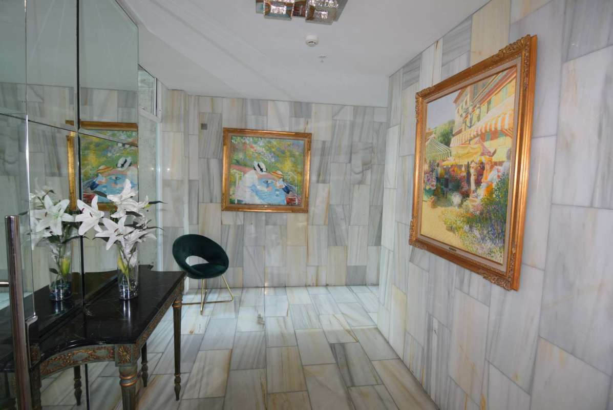 Kitchen with black granite countertops, appliances and large windows in PH Bela Vita Bella Vista Panama