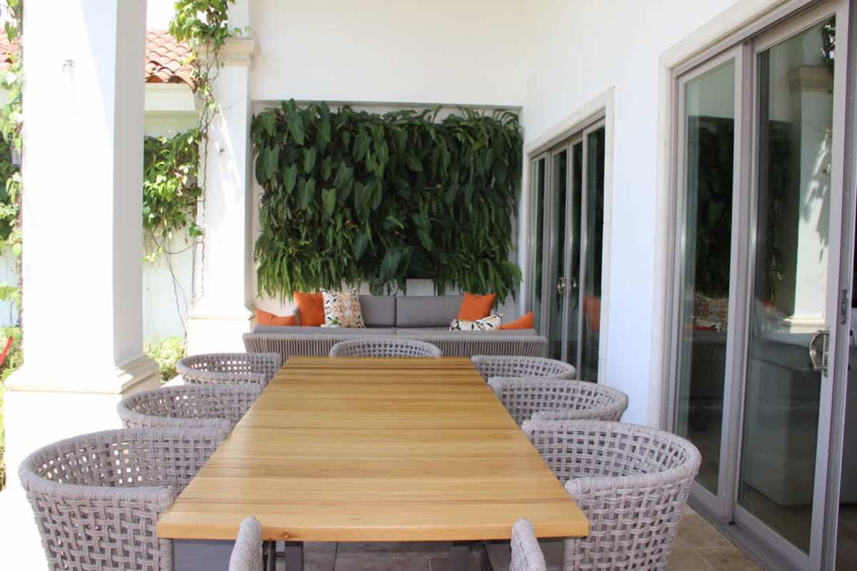 Lush backyard with patio furniture, garden space, golf views luxury house Santa María Panama