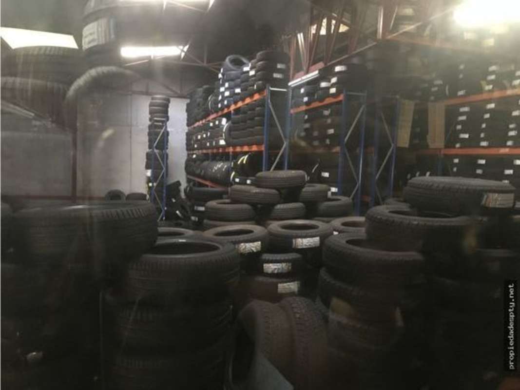 Warehouse with high ceilings and shelving with tires for commercial storage Panama City