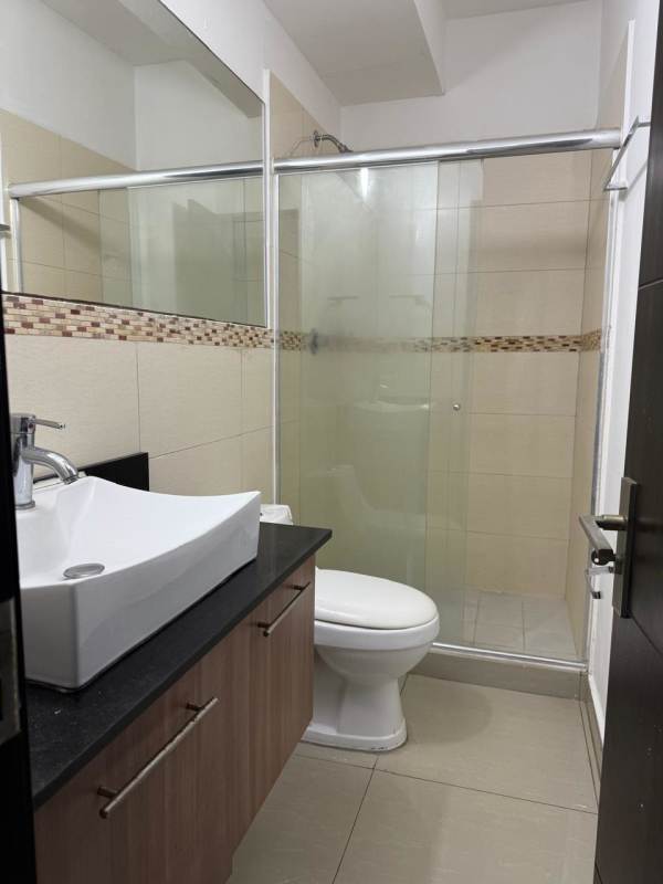 Modern bathroom with glass shower and vanity at PH Diamond Tower San Francisco Panama