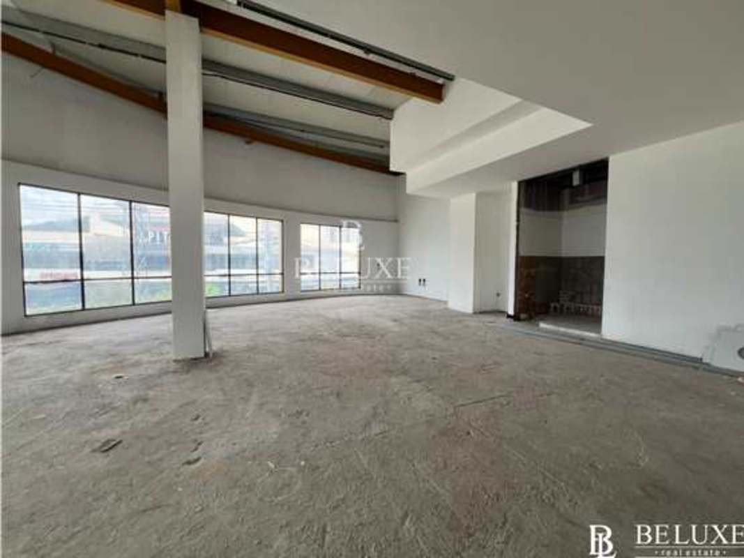 Unfinished shell commercial space with concrete floor exposed beams Premier Plaza Panama City