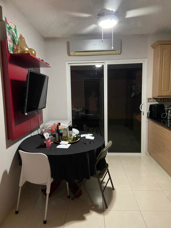 Private backyard swimming pool with lounge area and barbecue grill in Costa Bay house Costa del Este Panama