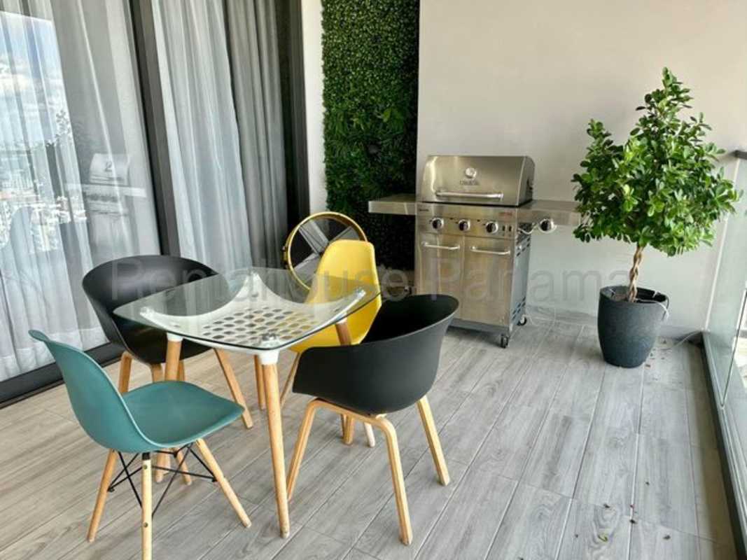 Open gourmet kitchen with marble countertops, island, and high-end appliances in PH Empire Residences