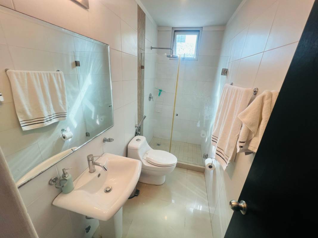 Bathroom with glass shower enclosure sink mirror PH Bella Vista Park Panama