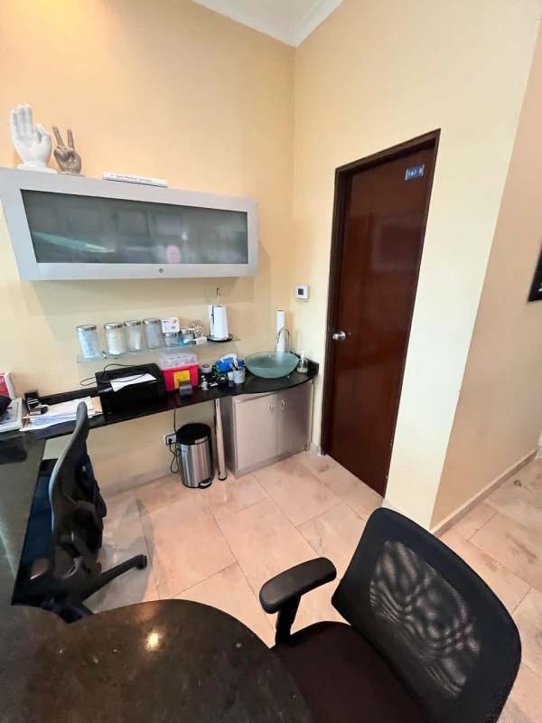Consultation room with granite sink, wall cabinet, and modern design in Hospital Punta Pacífica