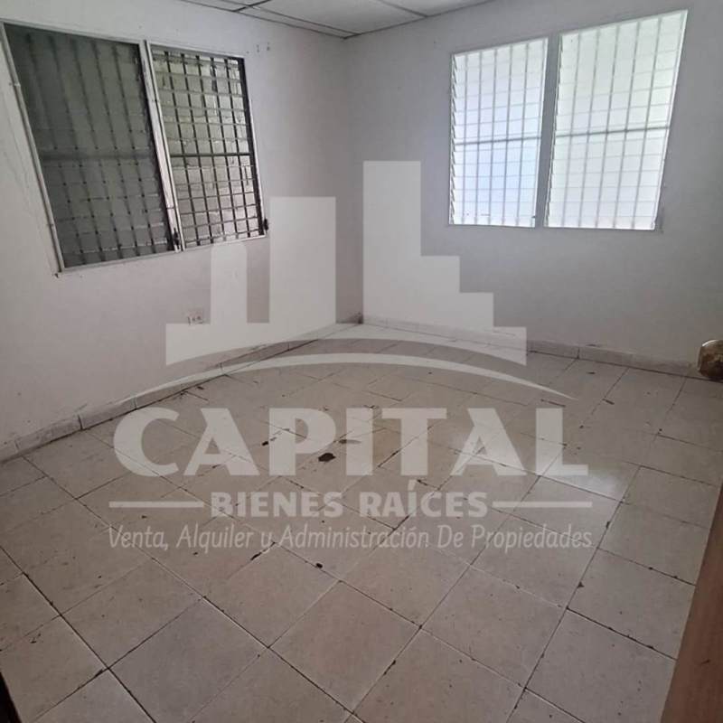 Interior empty room with window security bars and tile flooring in Don Bosco Panama house