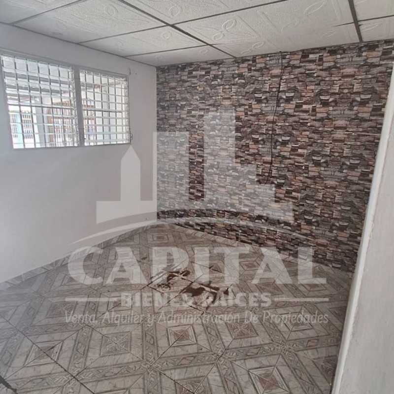 Covered front porch with columns and concrete driveway Don Bosco Panama home