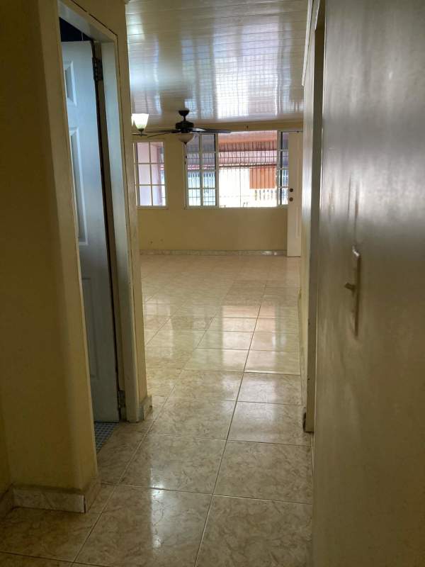 Covered tiled terrace with metal gate and security bars Villa Lucre Panama house for rent