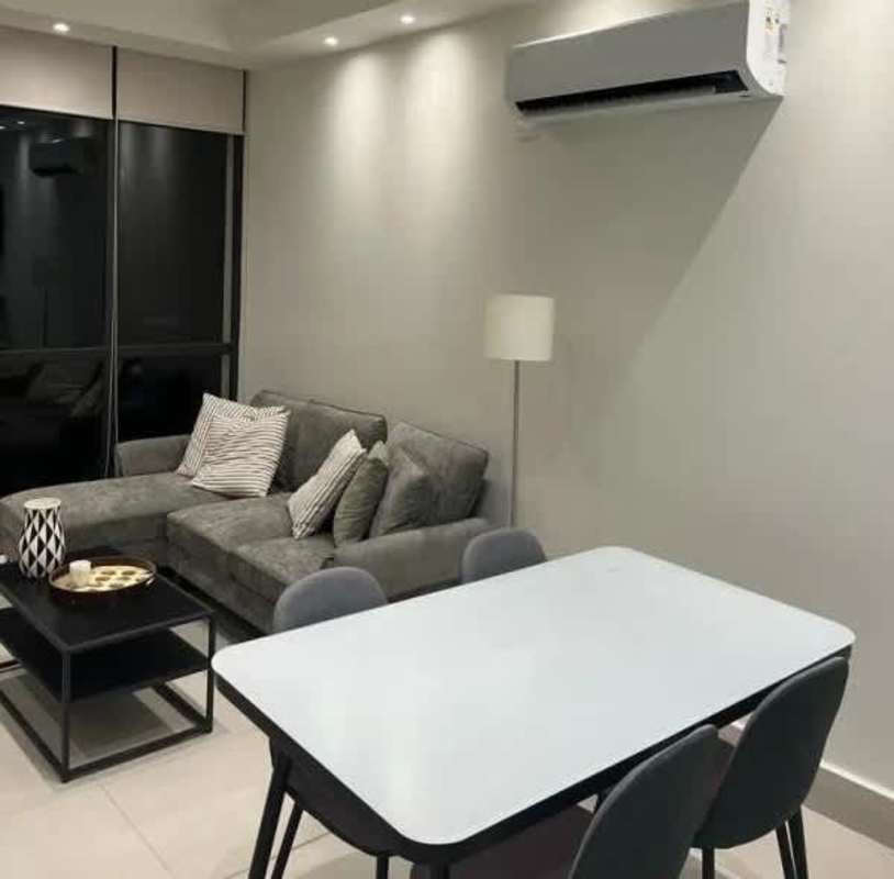 Furnished living dining room with sofa, AC, bright windows in PH Coco Place Panama