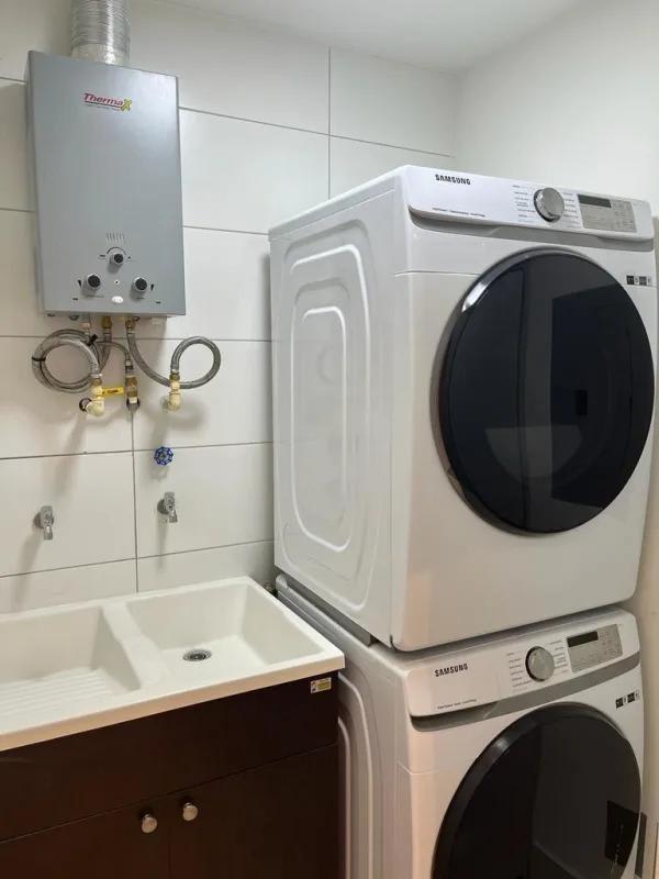 Laundry room in apartment at PH Coco Place with washer dryer, utility sink Panama