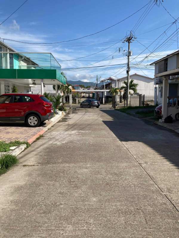 Gated neighborhood street view with two-story townhouses in PH Mirador del Bosque Pacora Panama