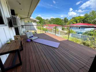 Kitchen with granite counters, electric stove, modern cabinets in Clayton Panama