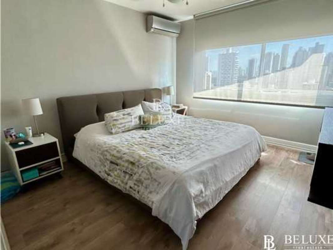 Bright bedroom with built-in closet, full window and skyline view in PH 7400 Panama City