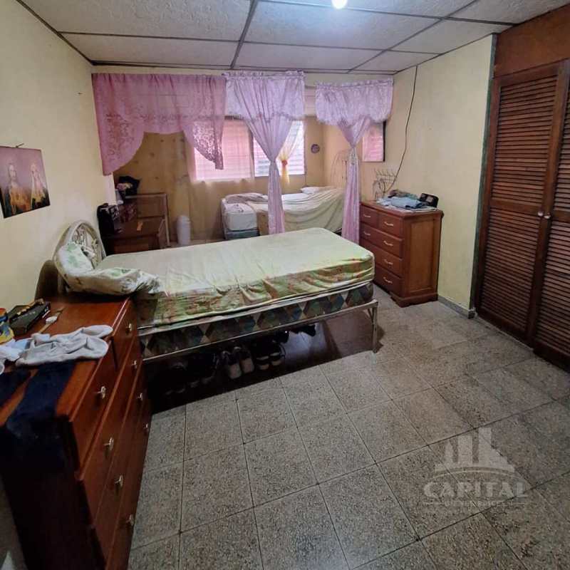Bedroom with two beds, closet, and tiled floor Don Bosco Panama City house sale