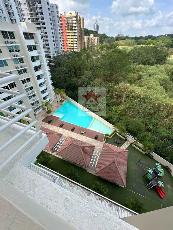 Aerial shot of swimming pool, green area, and residences in Green Park Panama