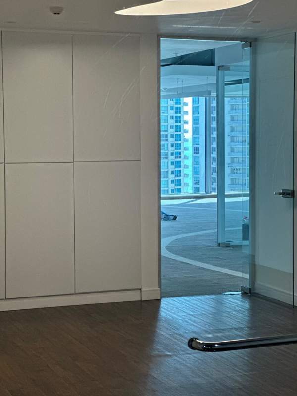Reception or lobby area inside the office with partial city views at PH BICSA Tower Panama City