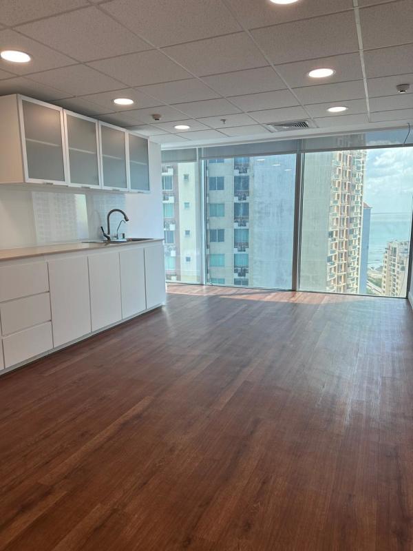 Small office kitchenette with built-in cabinets and stainless steel sink at PH BICSA Panama