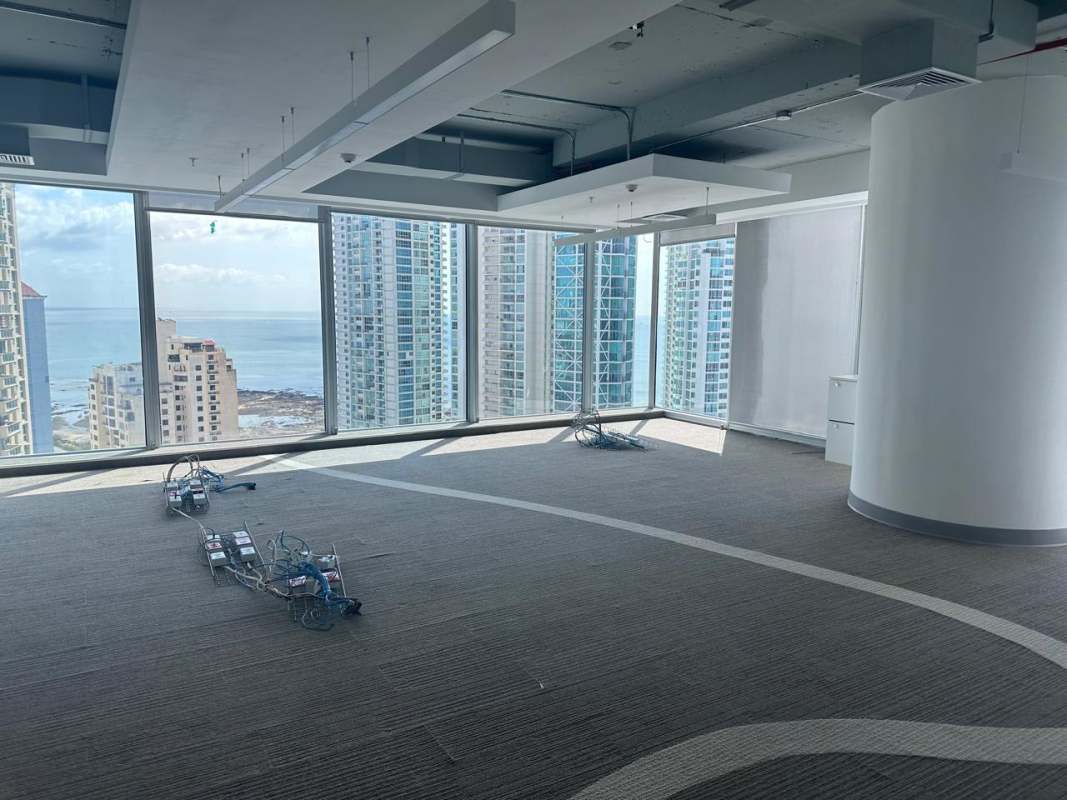 Unfurnished corner office with floor-to-ceiling windows featuring ocean and city views in PH BICSA Tower Panama