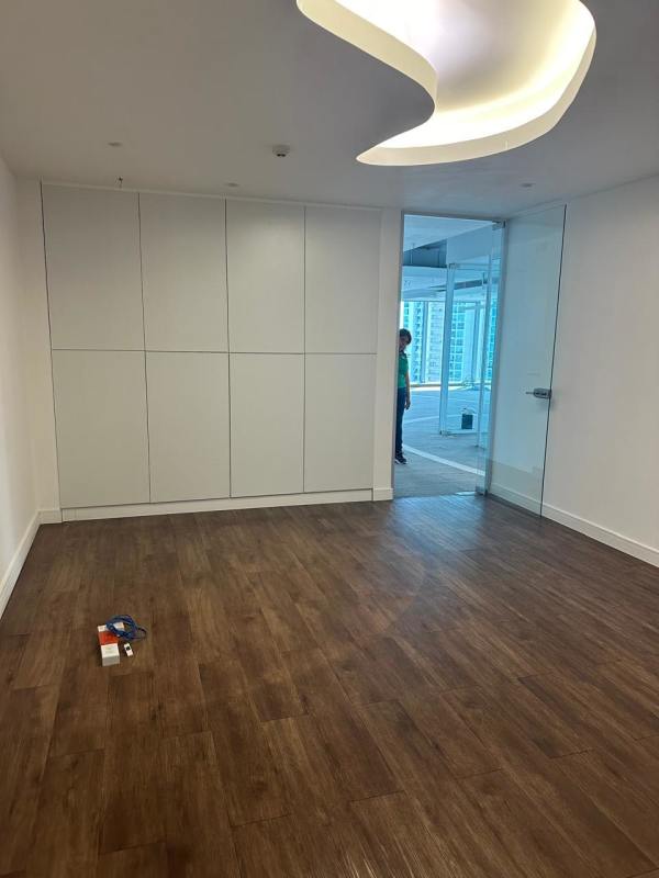 Modern private office area with glass partition and built-in cabinets at PH BICSA Tower Panama City