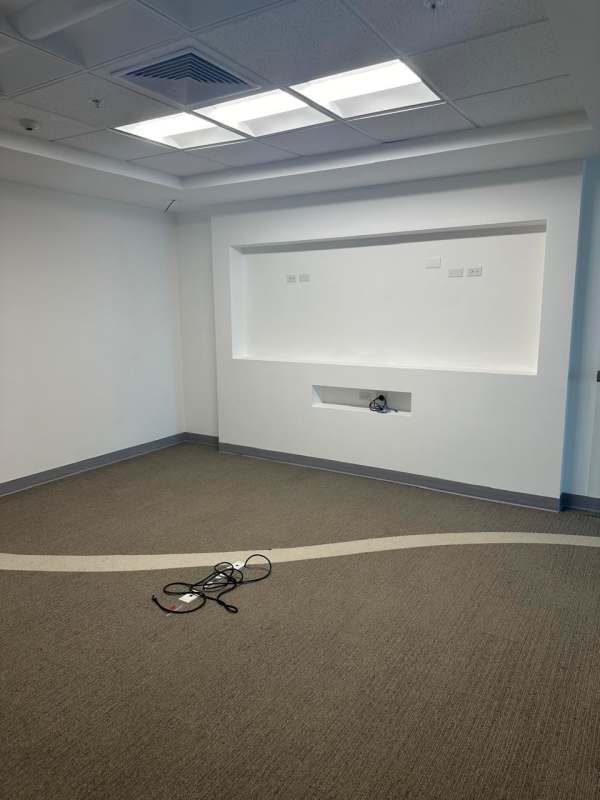 Empty interior office with carpet flooring, recessed lighting, and drop ceiling in PH BICSA Financial Center Panama
