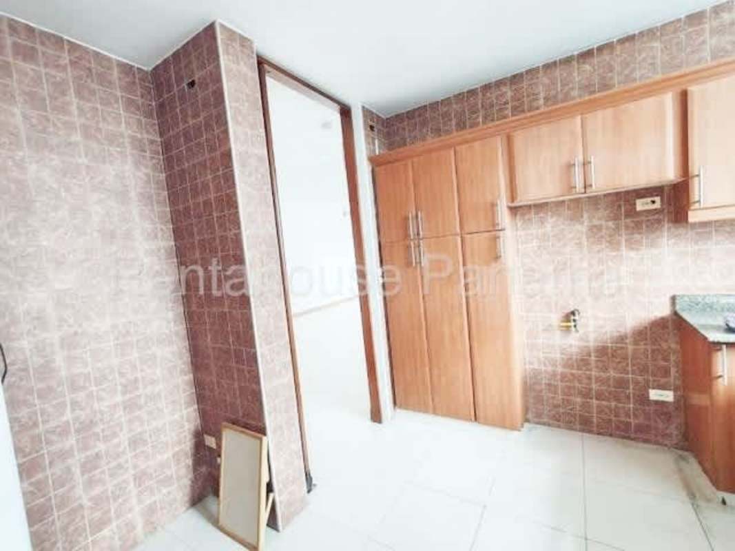 Kitchen with granite countertops and wood cabinetry PH El Cangrejo Panama City