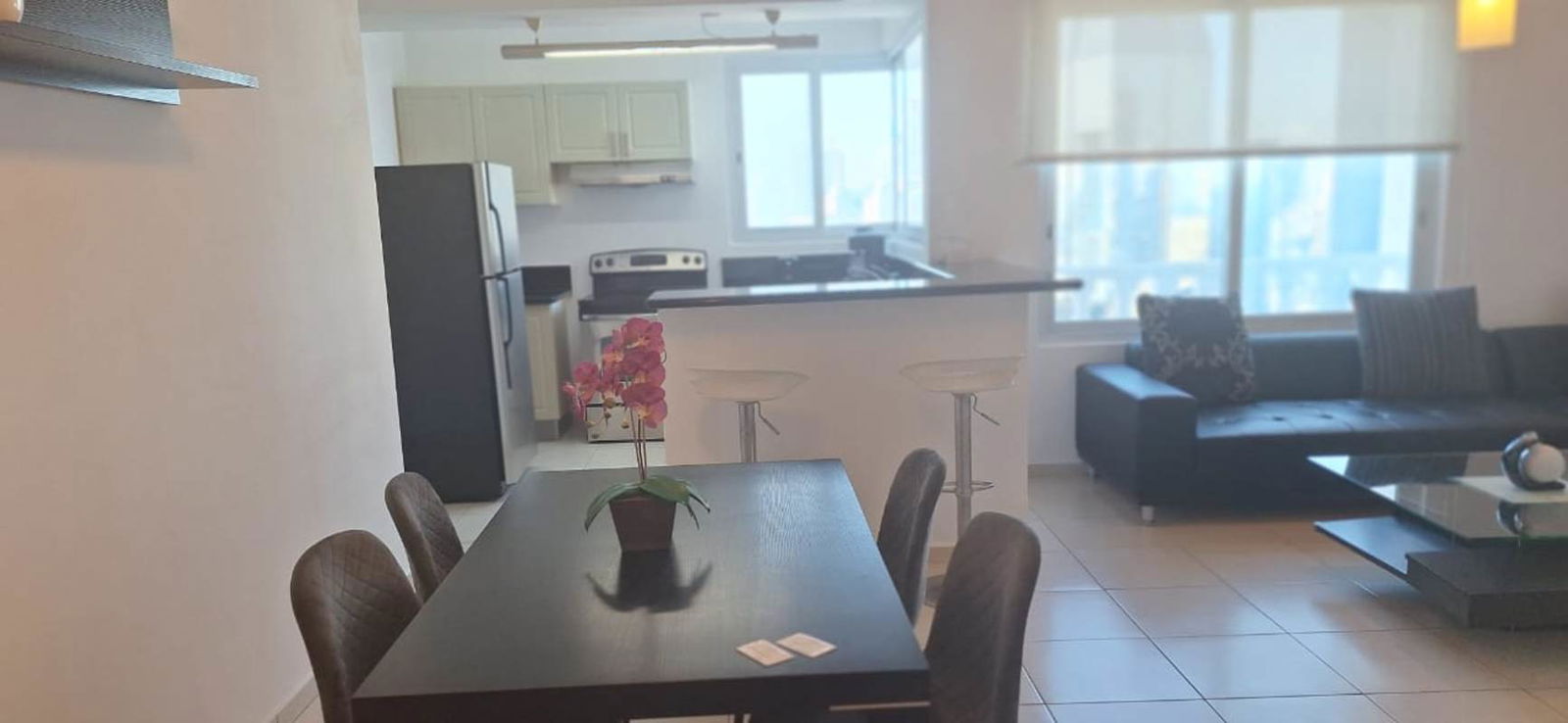 Modern living room with panoramic views and floor-to-ceiling windows at PH Vista del Mar Panama