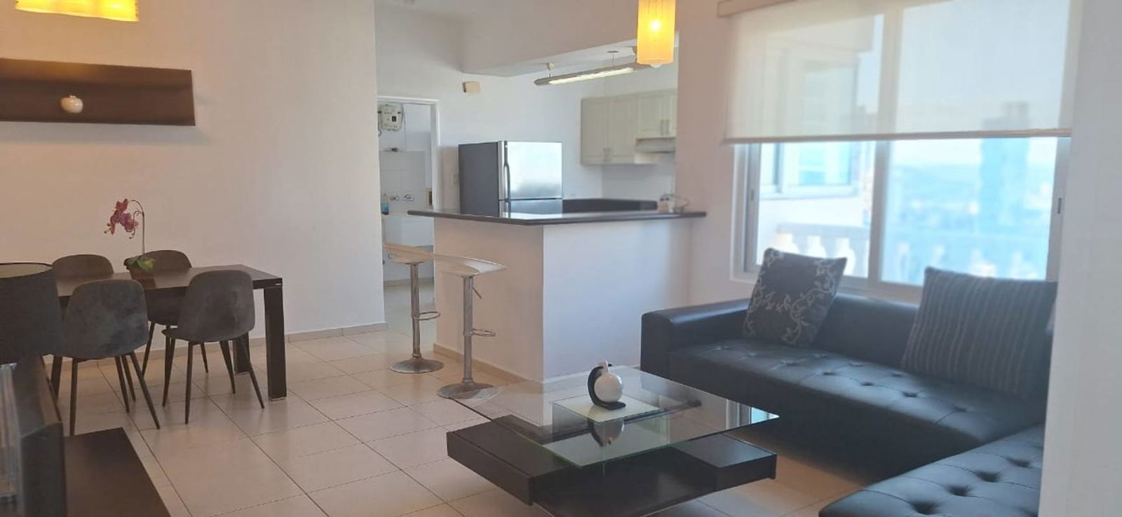 Open kitchen with breakfast counter and appliances in PH Vista del Mar Ave Balboa Panama